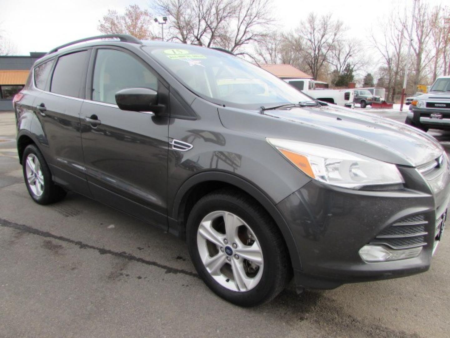 2015 Gray /Tan Ford Escape SE (1FMCU9G96FU) with an 2.0 I4 Ecoboost turbo engine engine, 6 speed automatic transmission, located at 4562 State Avenue, Billings, MT, 59101, (406) 896-9833, 45.769516, -108.526772 - 2015 Ford Escape SE 4WD 2.0 Ecoboost Turbo 4 cylinder engine - 6 speed automatic transmission - 4WD - 151,468 miles $256 per month - payment example based on $1000 cash or trade down - 36 months at 7.99 percent APR - on approved credit SE package - air conditioning - tilt and steering wheel - Photo#4